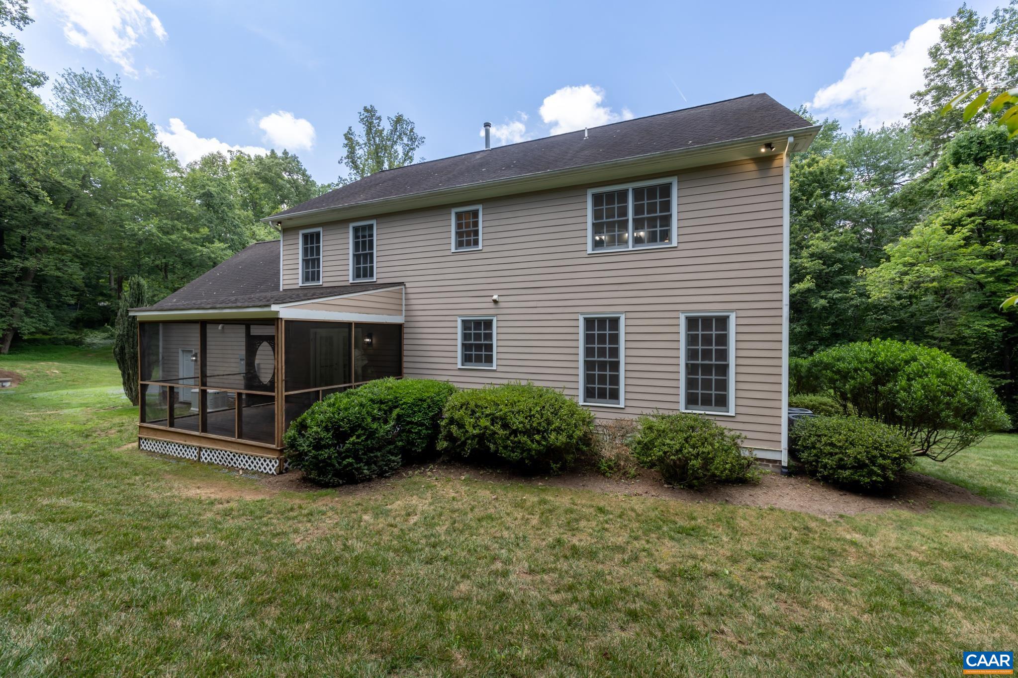 505 Georgetown Road Charlottesville, VA 22901 - Photo 24 of 73 a view of a house with a yard plants and large tree