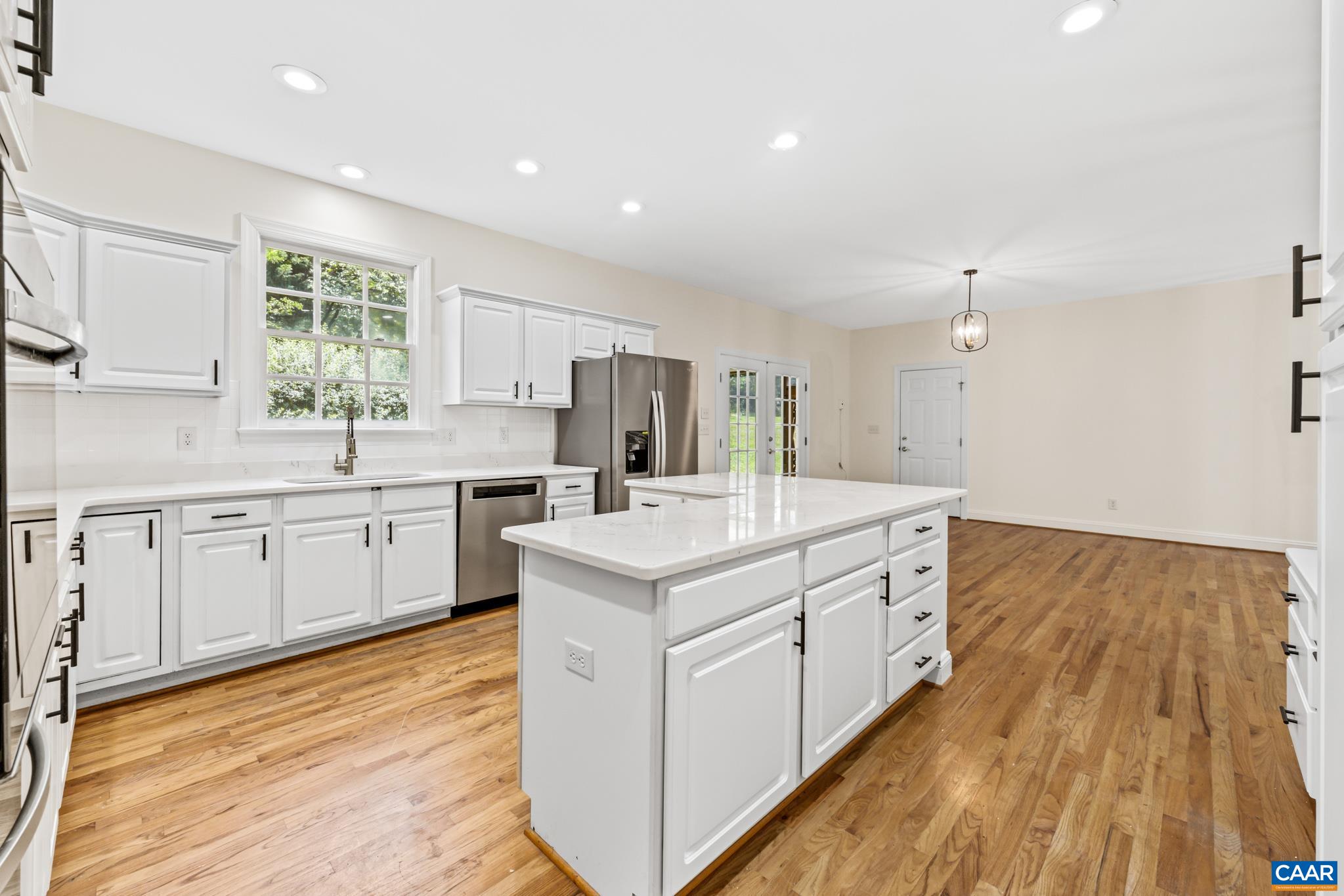 505 Georgetown Road Charlottesville, VA 22901 - Photo 36 of 73 a kitchen with a sink stove and cabinets