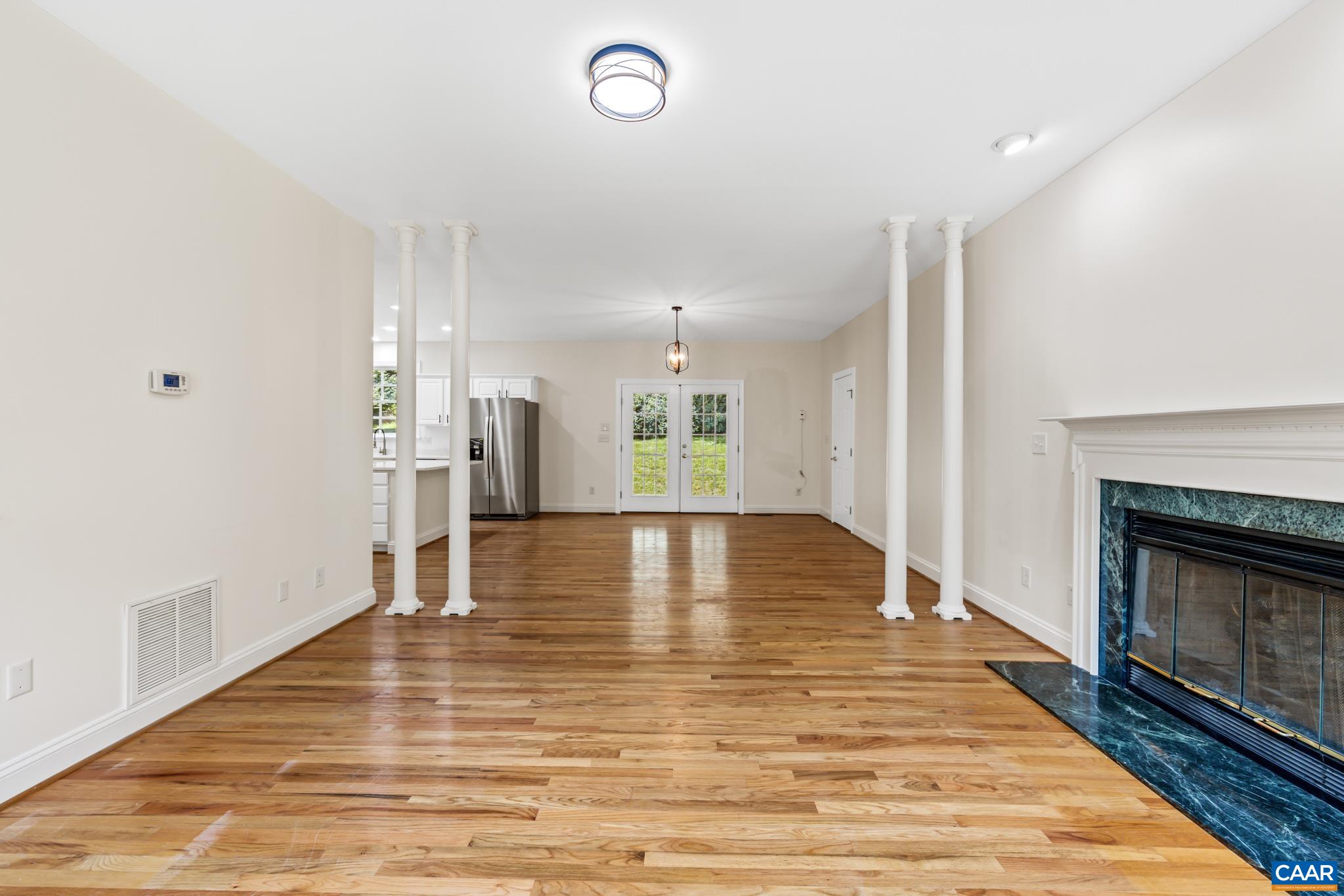 505 Georgetown Road Charlottesville, VA 22901 - Photo 43 of 73 a view of empty room with wooden floor and fireplace
