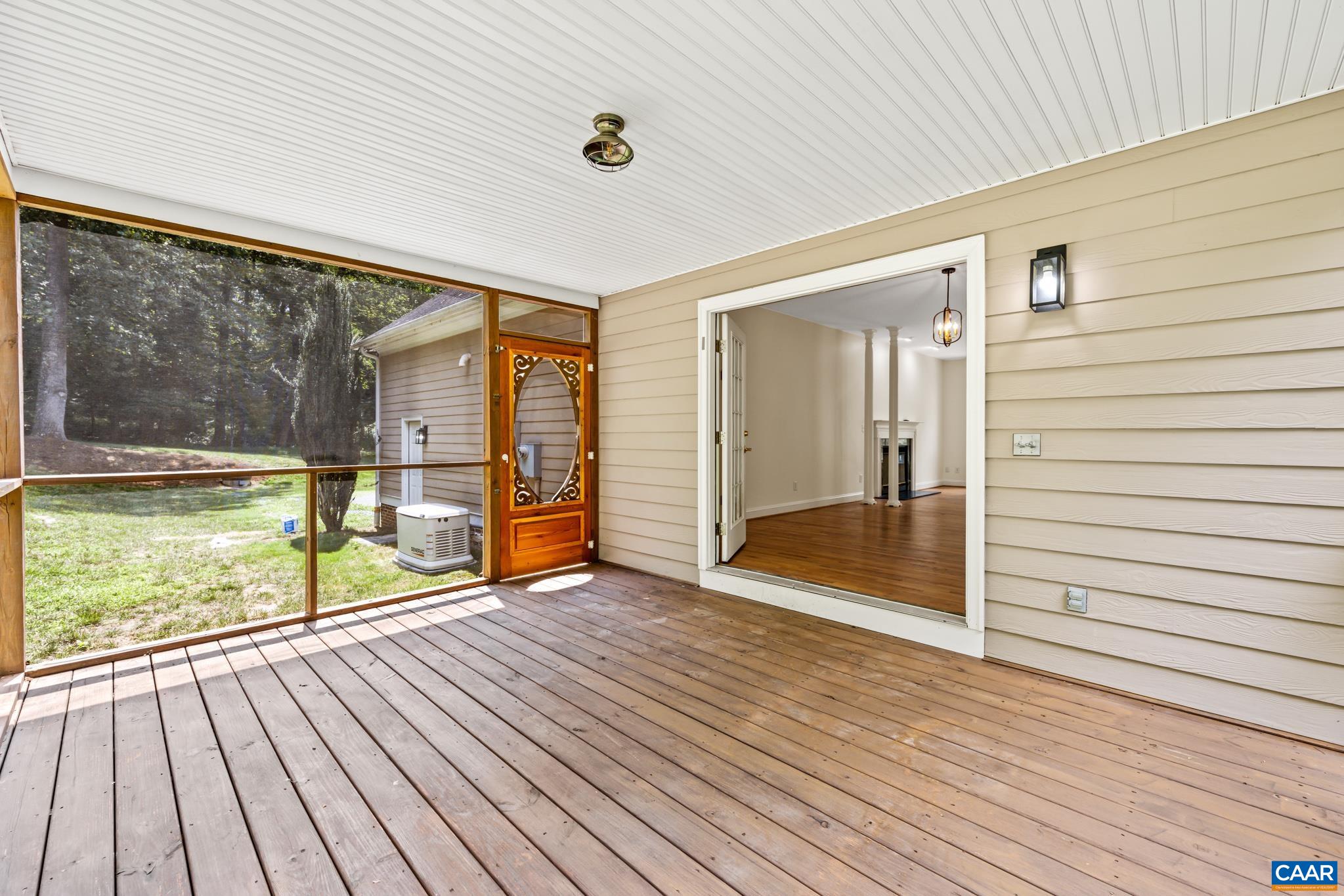 505 Georgetown Road Charlottesville, VA 22901 - Photo 46 of 73 a view of a porch with wooden floor and floor to ceiling window
