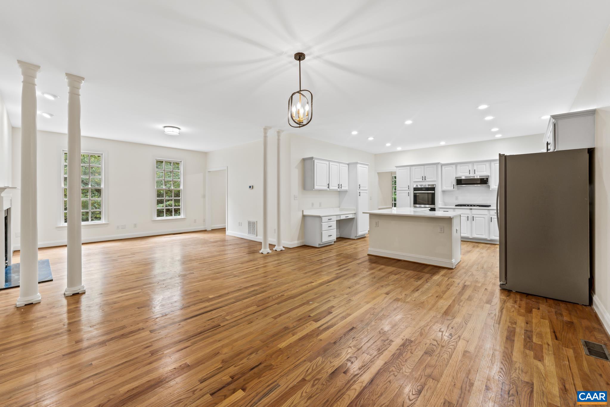 505 Georgetown Road Charlottesville, VA 22901 - Photo 48 of 73 a view of a kitchen with a refrigerator wooden floor and a window