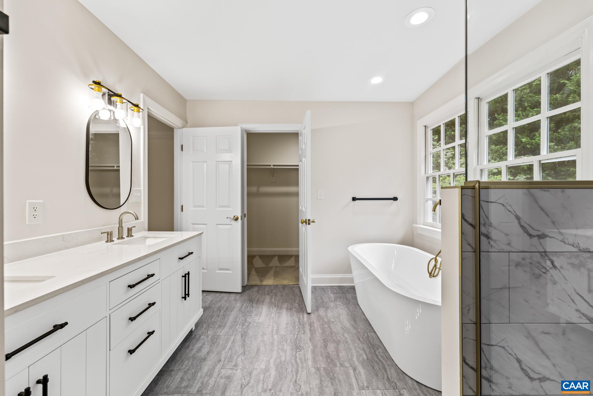 505 Georgetown Road Charlottesville, VA 22901 - Photo 62 of 73 a bathroom with a double vanity sink a toilet a mirror and shower