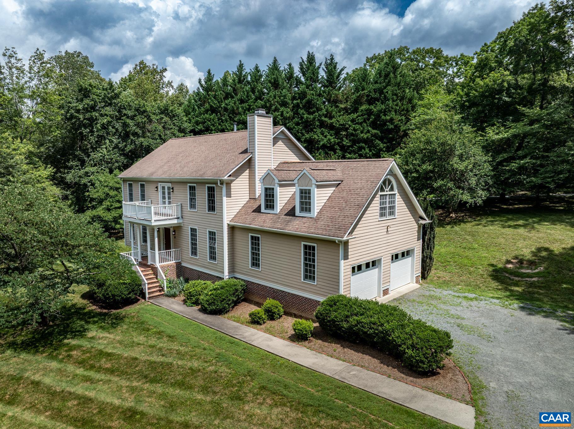 505 Georgetown Road Charlottesville, VA 22901 - Photo 7 of 73 a aerial view of a house with a yard and potted plants