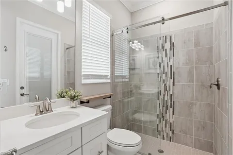 a bedroom with a bed and a mirror