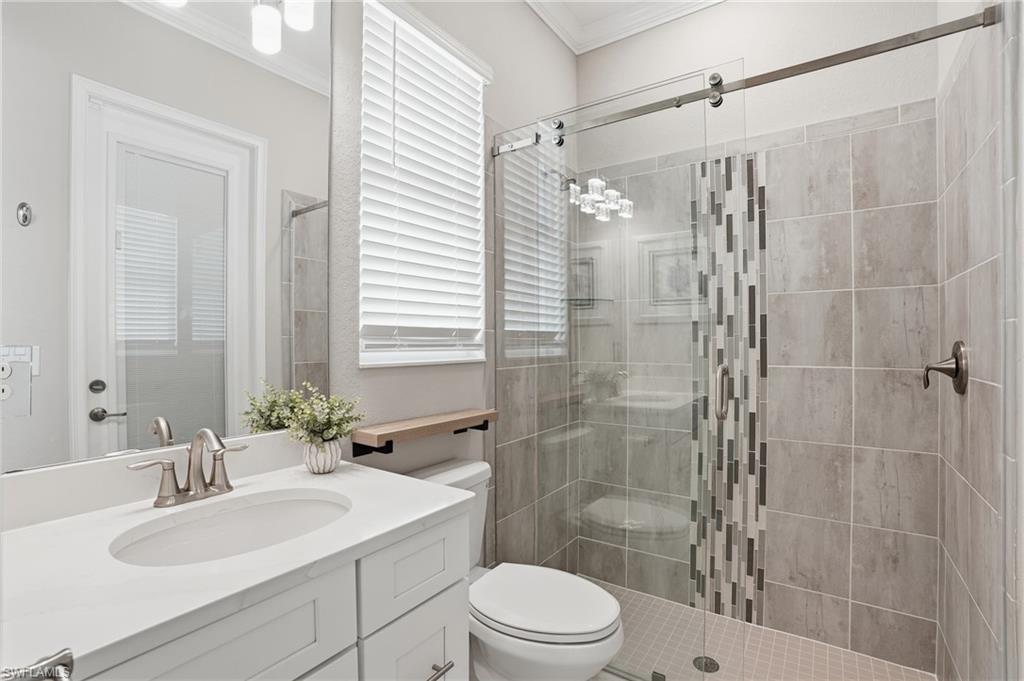 14882 Blue Bay Circle Fort Myers, FL 33913 - Photo 26 of 50 a bathroom with a sink a toilet and shower