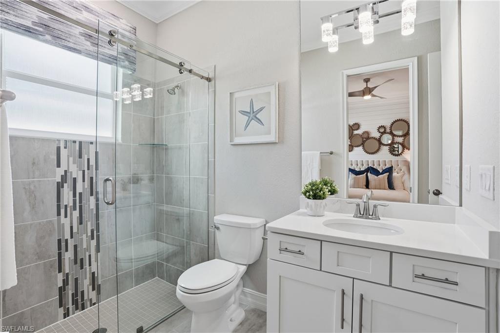14882 Blue Bay Circle Fort Myers, FL 33913 - Photo 29 of 50 a bathroom with a sink toilet and shower