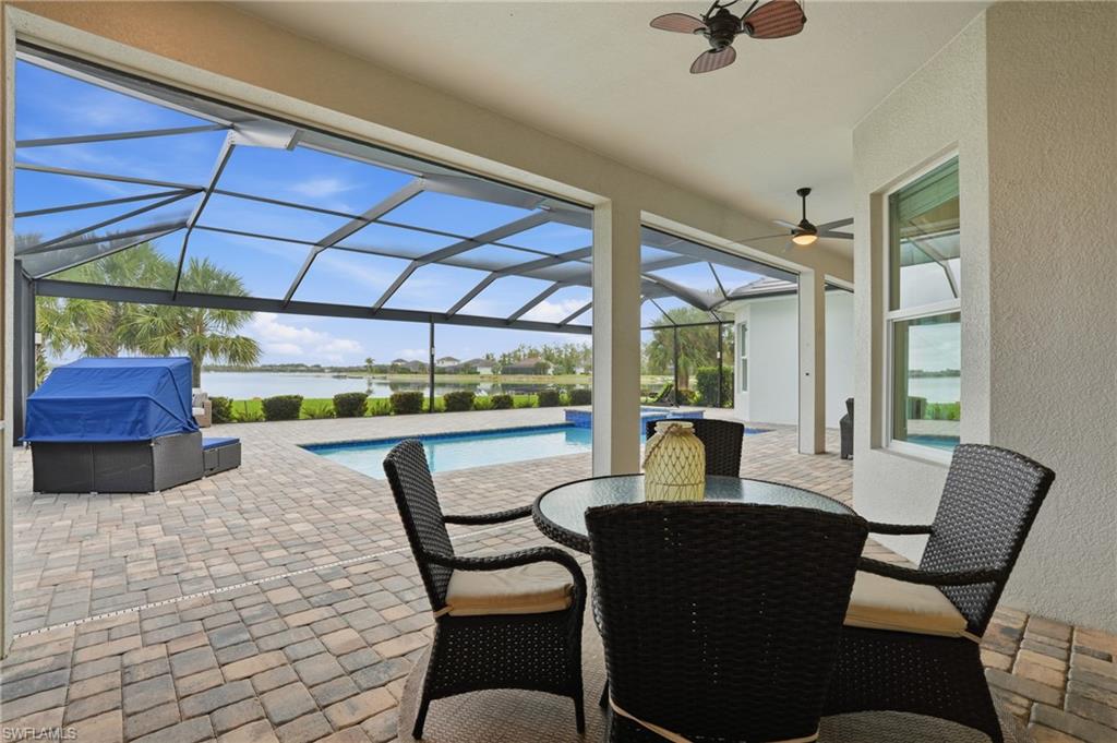 14882 Blue Bay Circle Fort Myers, FL 33913 - Photo 34 of 50 a dining room with furniture and a floor to ceiling window