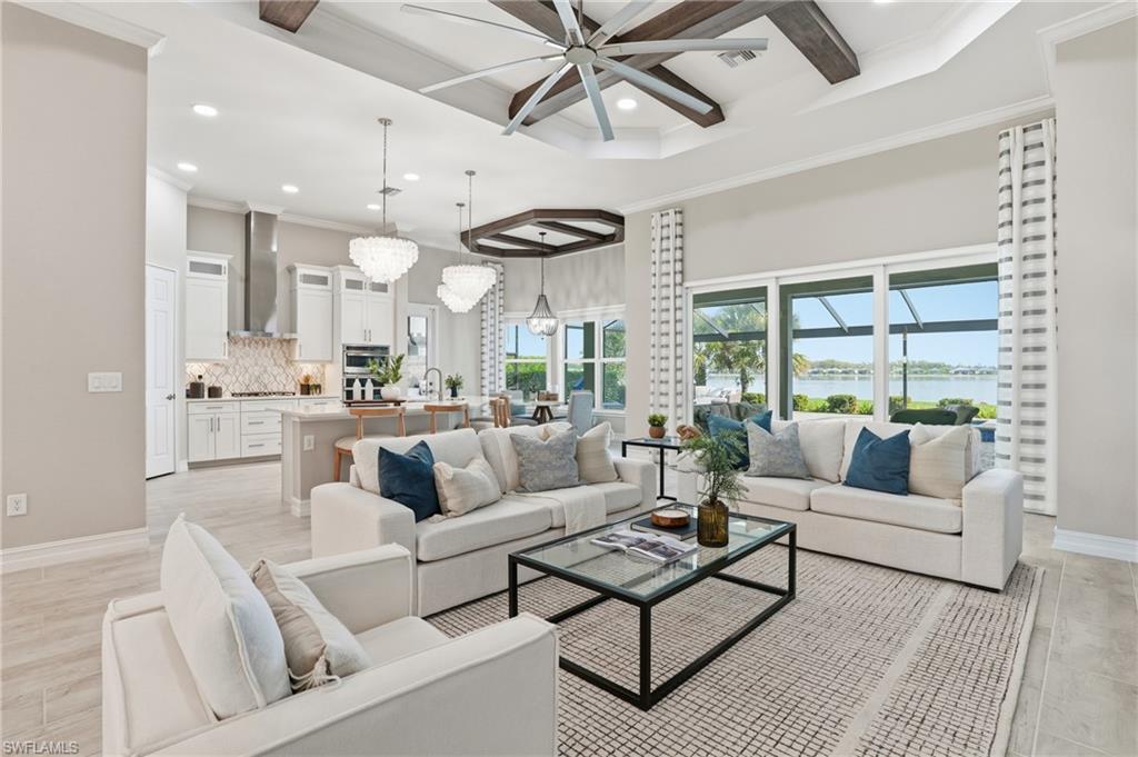 14882 Blue Bay Circle Fort Myers, FL 33913 - Photo 7 of 50 a living room with furniture and a large window with wooden floor