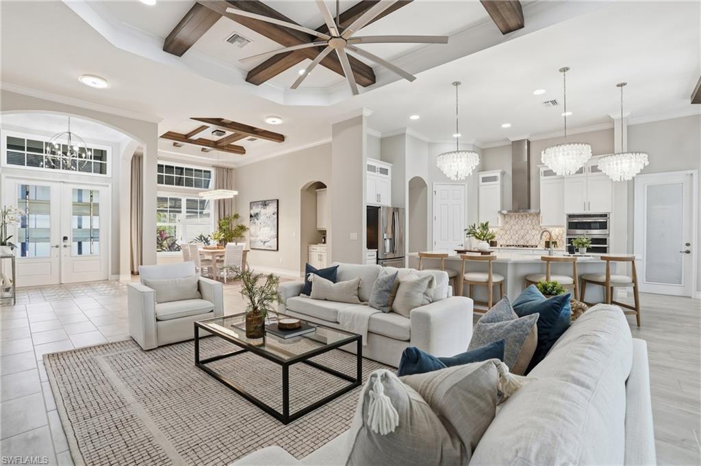 14882 Blue Bay Circle Fort Myers, FL 33913 - Photo 8 of 50 a living room with furniture kitchen view and a chandelier