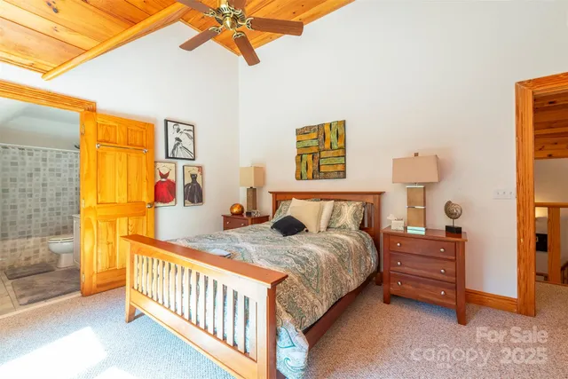 a bathroom with a granite countertop sink a toilet and a mirror
