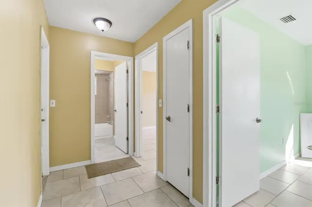 a view of a bathroom with a tub and shower
