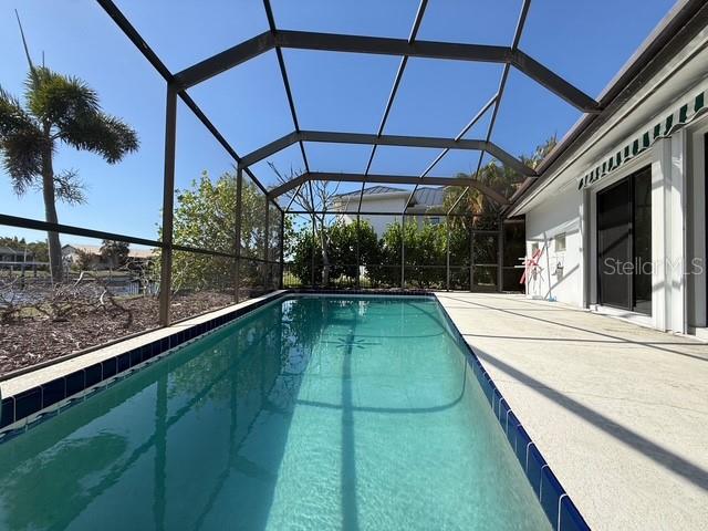 191 Maria Court Punta Gorda, FL 33950 - Photo 1 of 24 a view of a backyard with a swimming pool