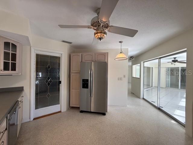 191 Maria Court Punta Gorda, FL 33950 - Photo 6 of 24 a view of a livingroom with a ceiling fan and entryway