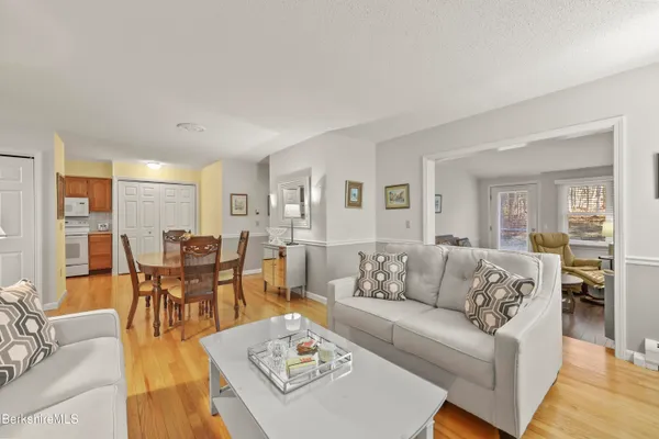 a living room with furniture dining table and a couch