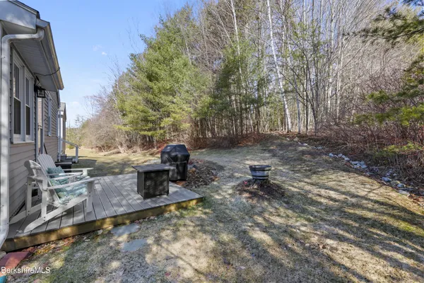 a view of a backyard with sitting area