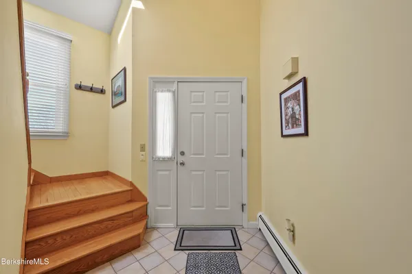 a view of room with window and a ceiling fan