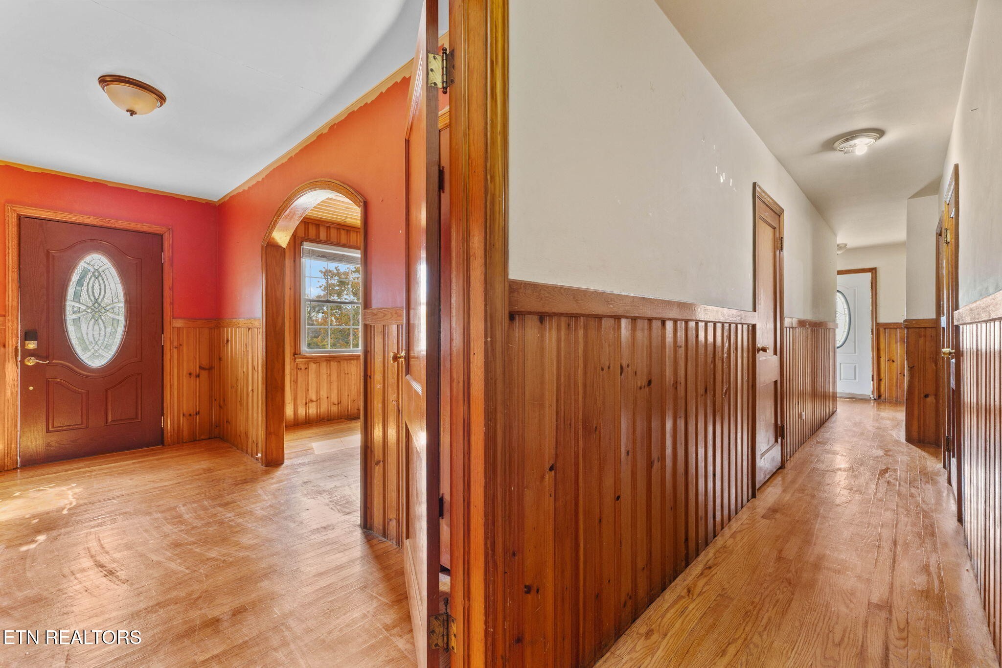302 Hickory Street Clinton, TN 37716 - Photo 14 of 38 a view of a hallway with wooden floor
