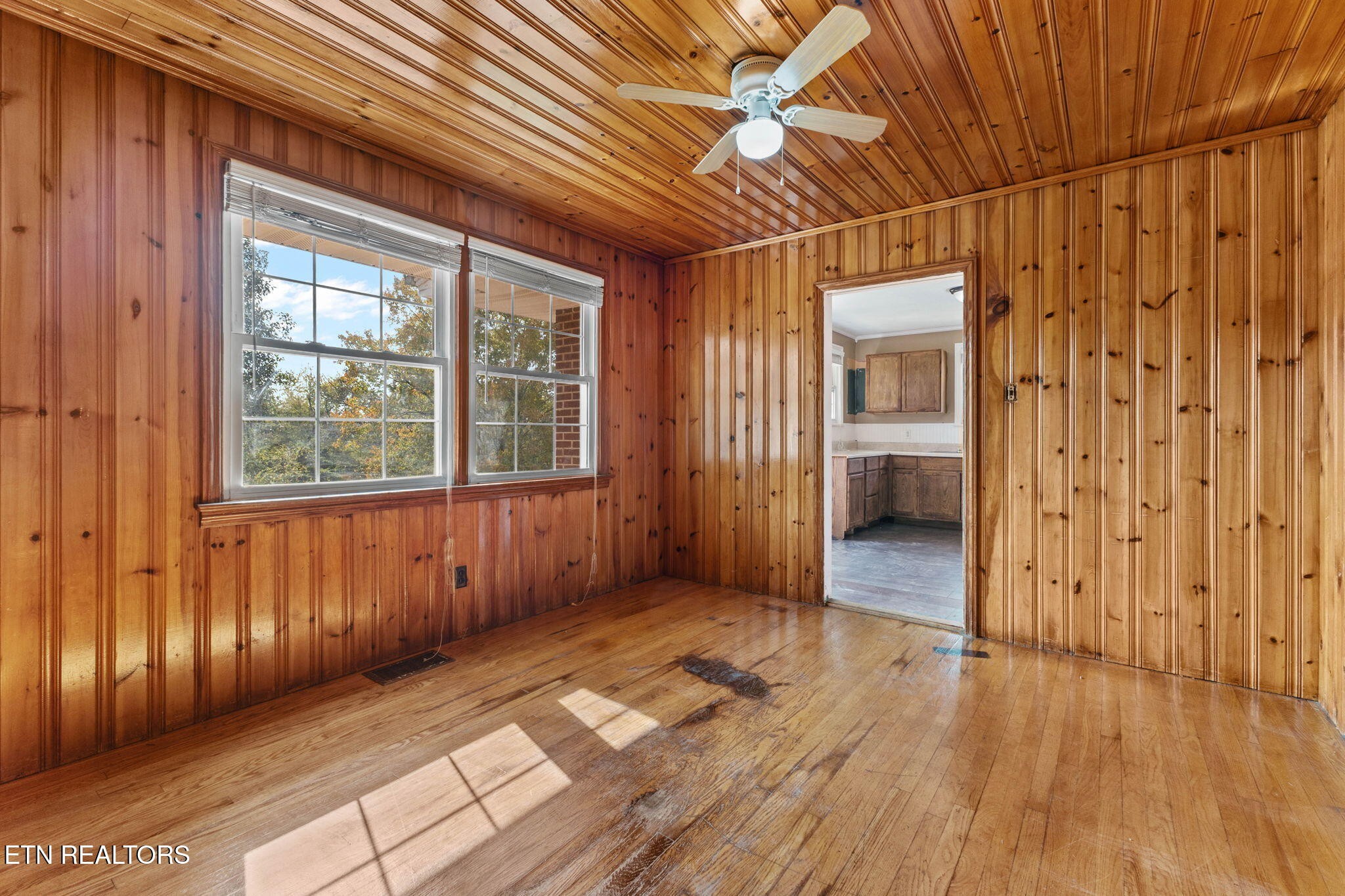 302 Hickory Street Clinton, TN 37716 - Photo 17 of 38 a view of a hallway with wooden floor and a bathroom