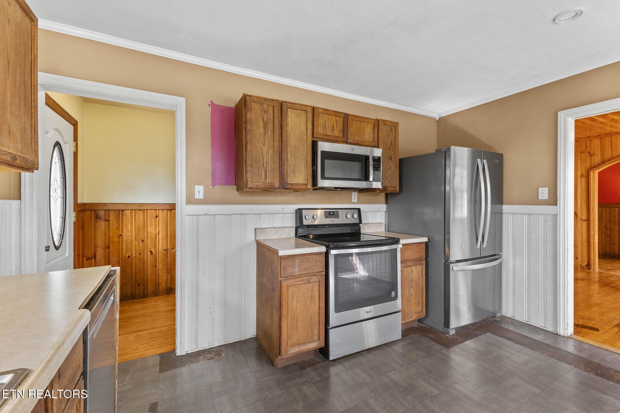 302 Hickory Street Clinton, TN 37716 - Photo 19 of 38 a kitchen with stainless steel appliances granite countertop a refrigerator a stove top oven a sink and dishwasher