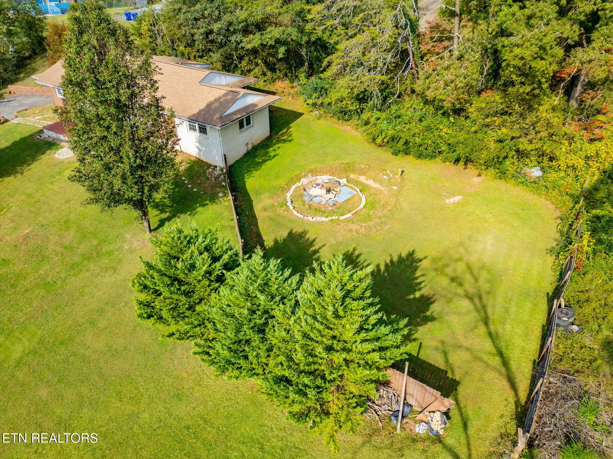 302 Hickory Street Clinton, TN 37716 - Photo 2 of 38 a view of a back yard of the house
