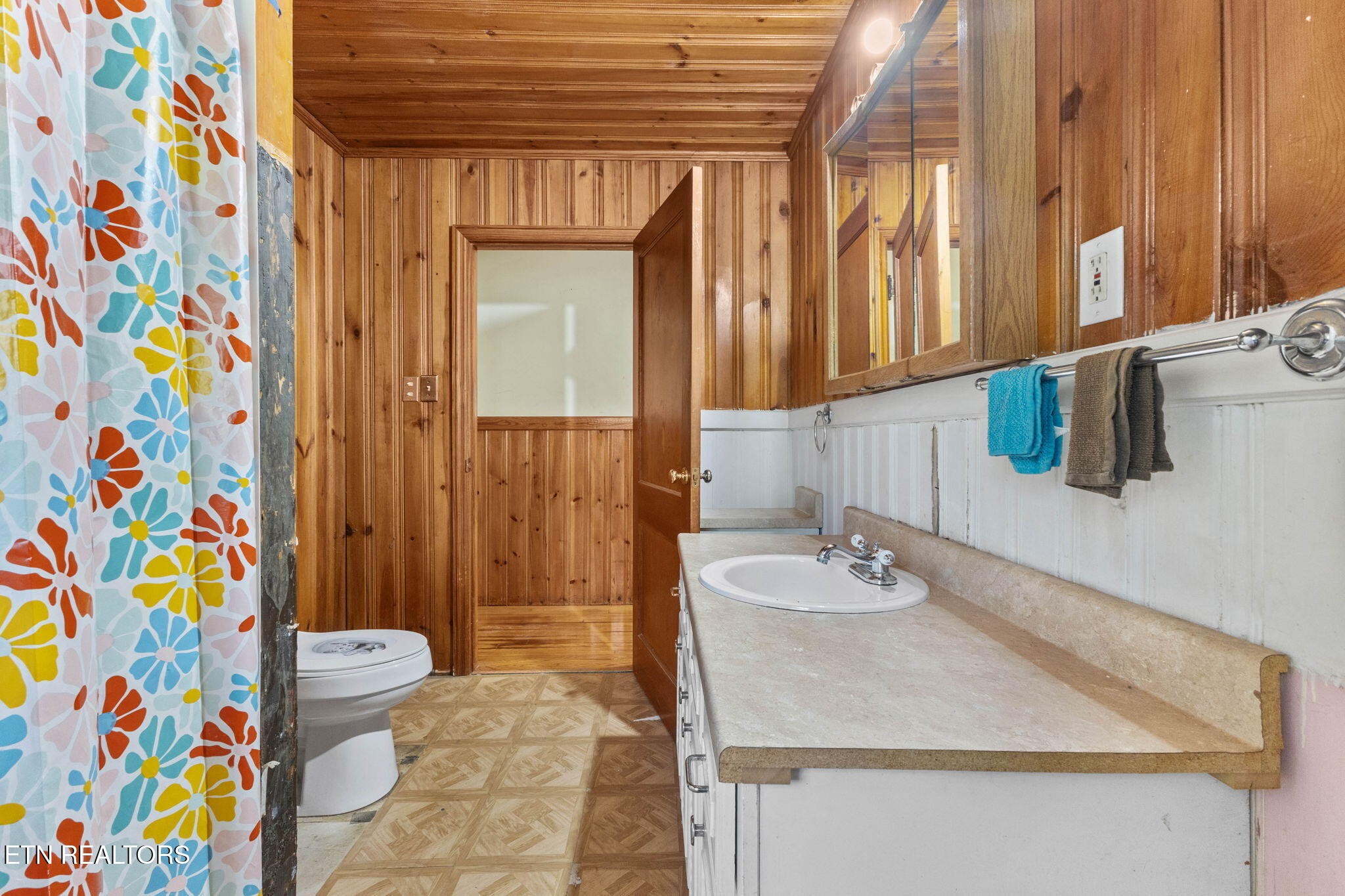 302 Hickory Street Clinton, TN 37716 - Photo 24 of 38 a bathroom with a sink a toilet and a shower curtain