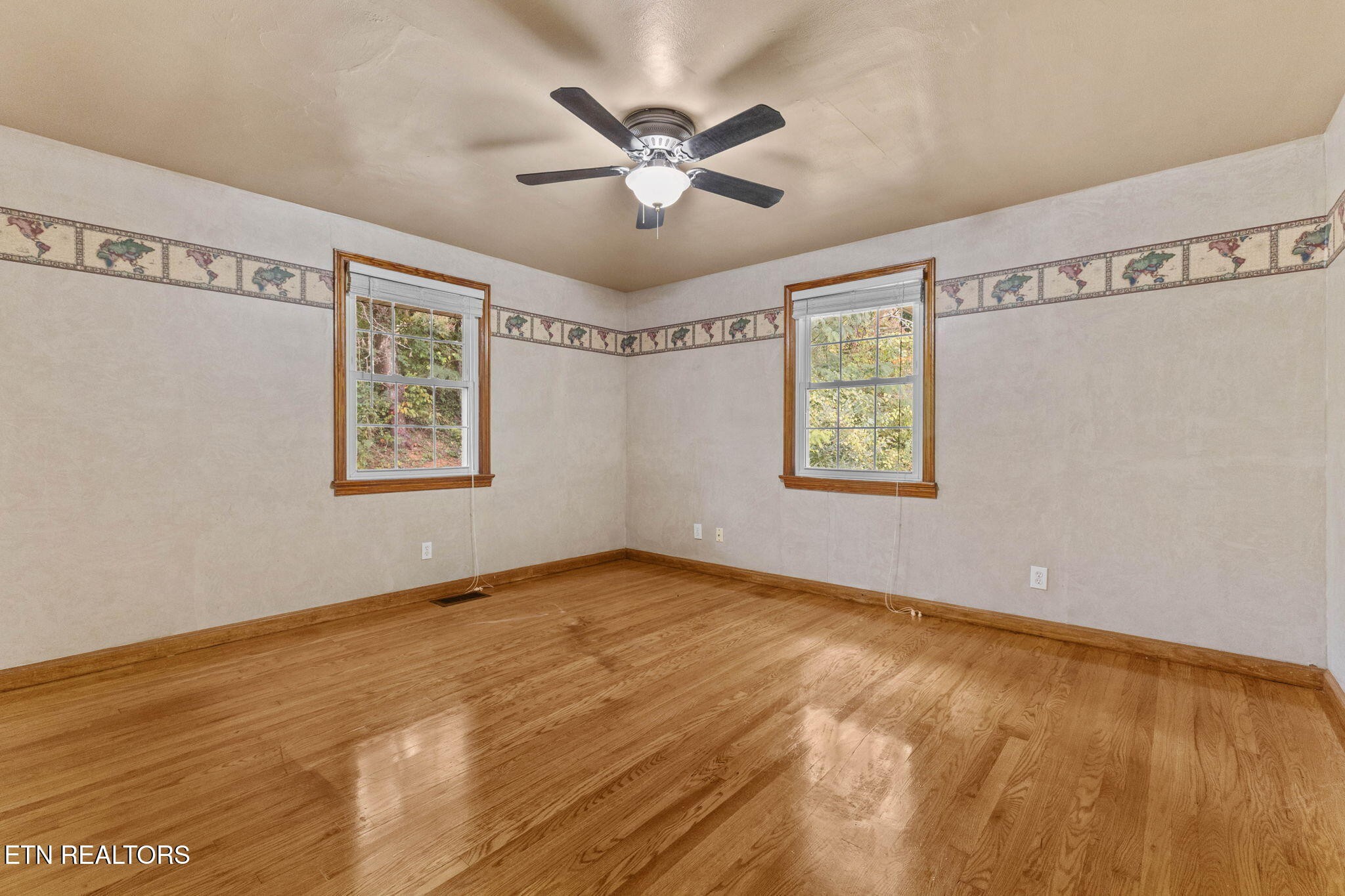 302 Hickory Street Clinton, TN 37716 - Photo 25 of 38 a view of an empty room with window and a ceiling fan
