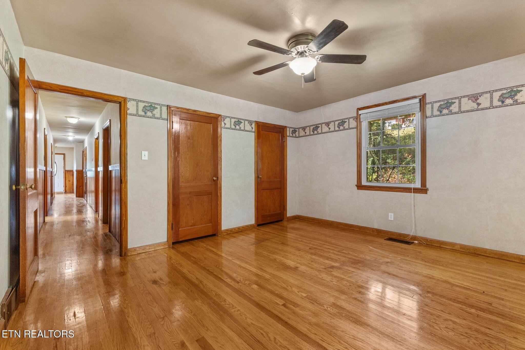 302 Hickory Street Clinton, TN 37716 - Photo 26 of 38 a view of an empty room with wooden floor