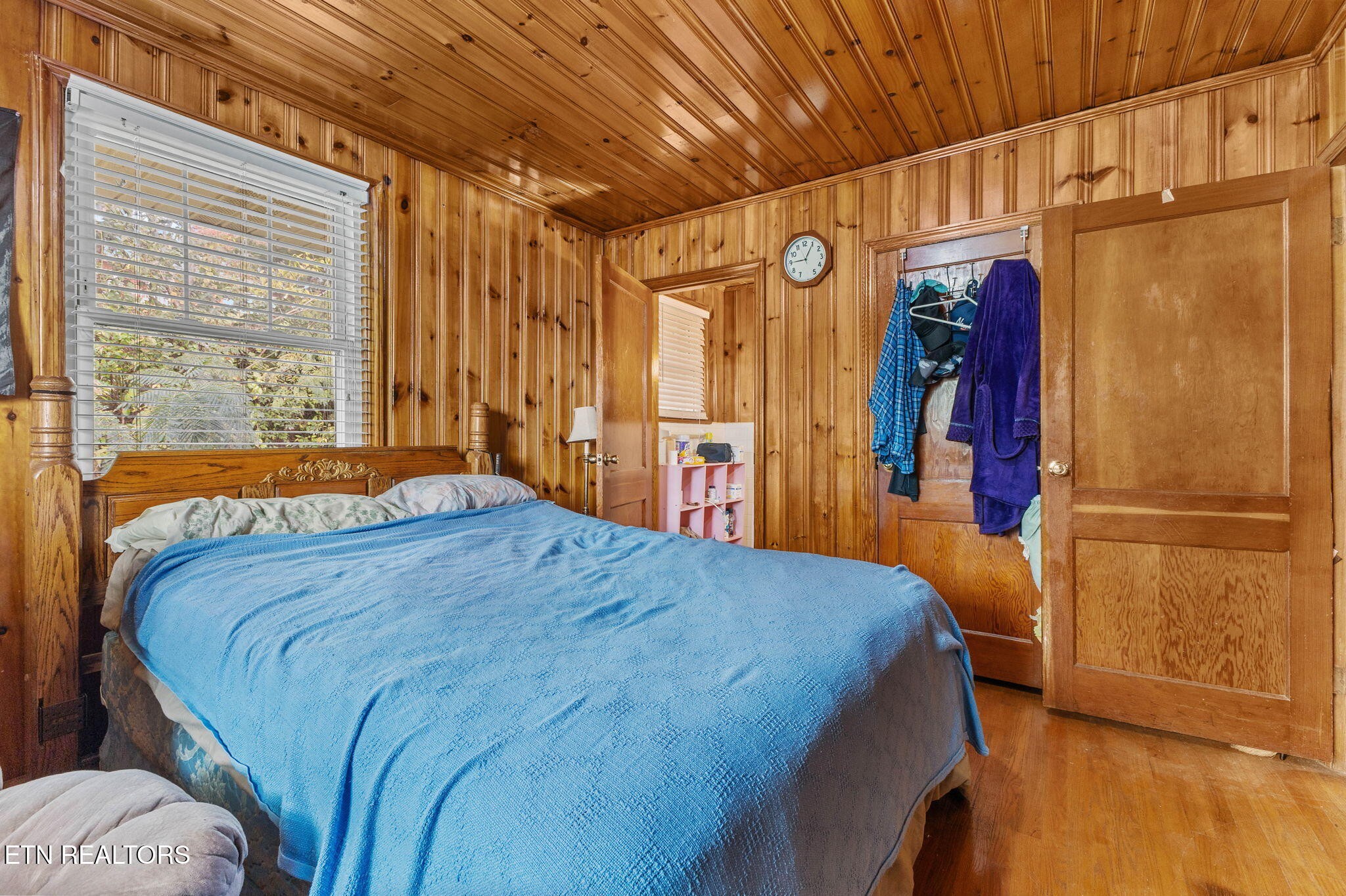 302 Hickory Street Clinton, TN 37716 - Photo 27 of 38 a bedroom with a bed and a large window