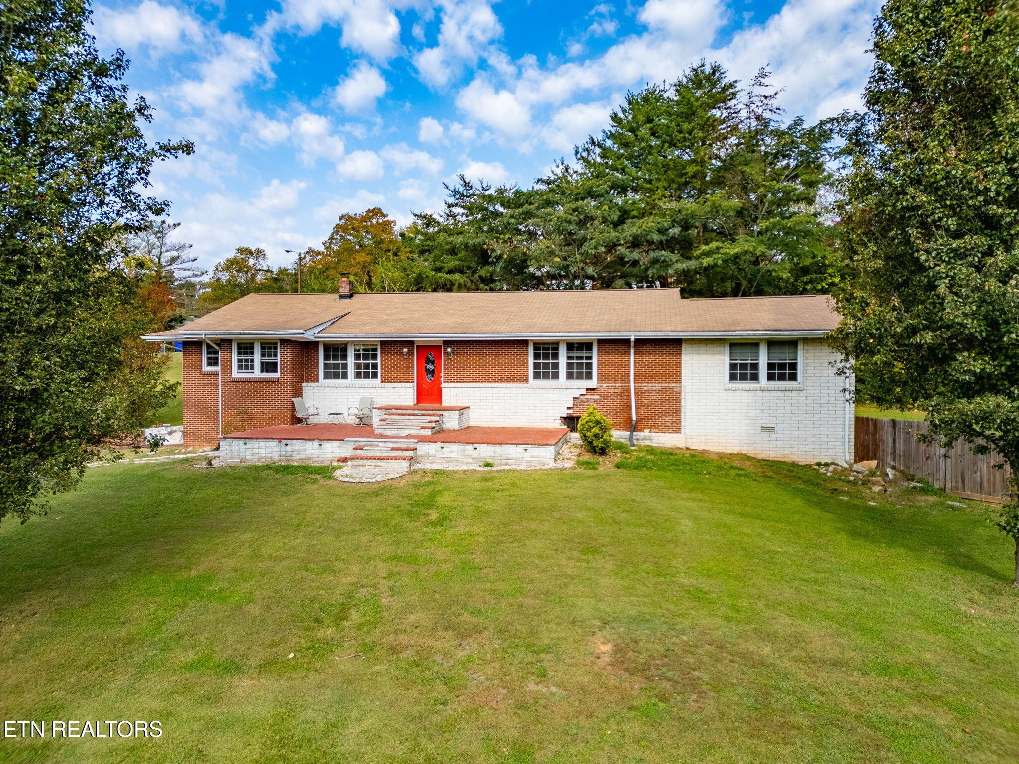 302 Hickory Street Clinton, TN 37716 - Photo 37 of 38 a view of a house with a backyard
