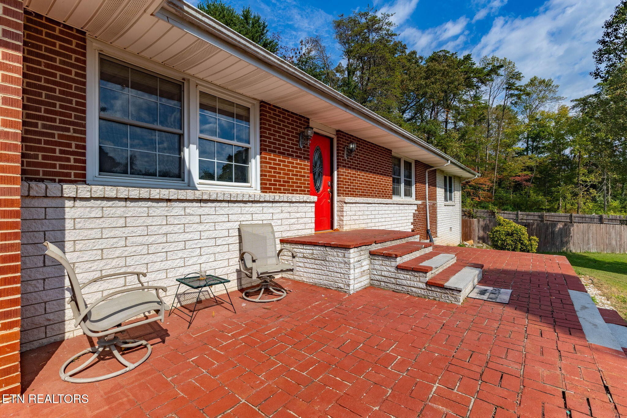302 Hickory Street Clinton, TN 37716 - Photo 4 of 38 a backyard of a house with seating space