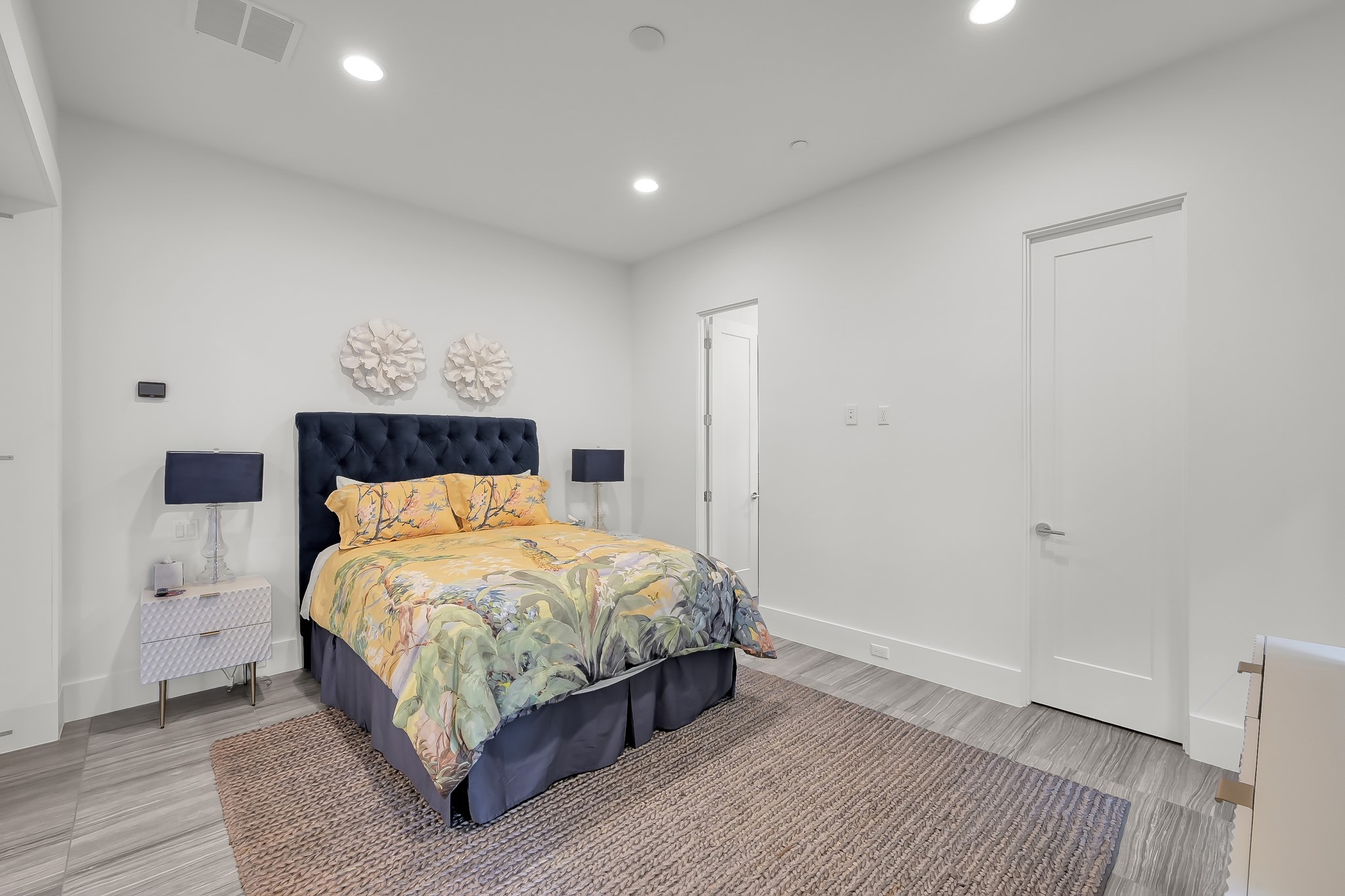 3207 Revere Street Houston, TX 77098 - Photo 11 of 50 a bedroom with a bed and a painting on the wall
