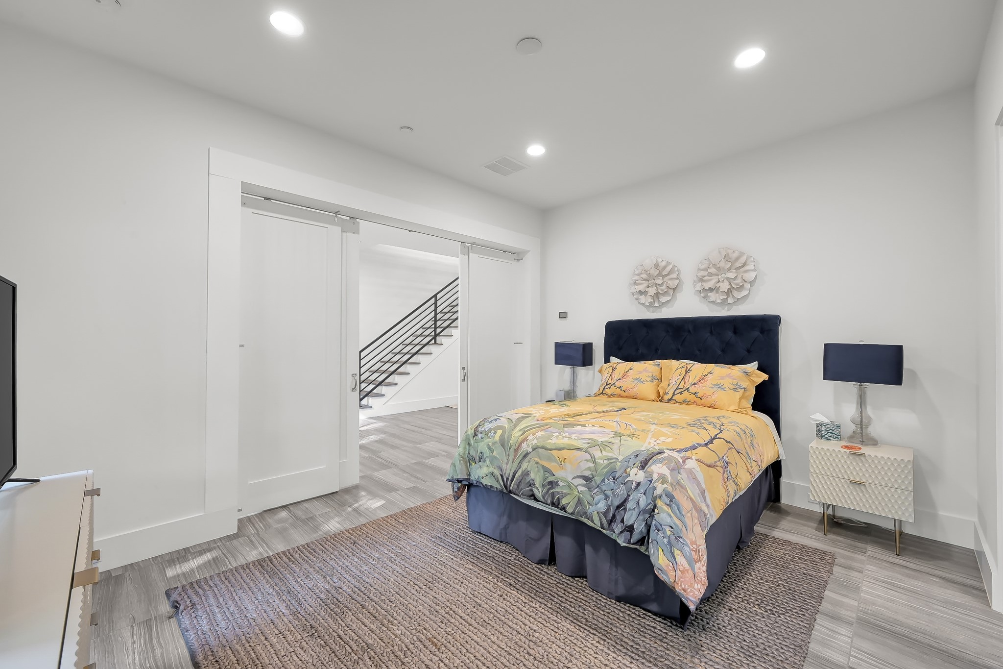 3207 Revere Street Houston, TX 77098 - Photo 12 of 50 a bedroom with a bed and a night stand