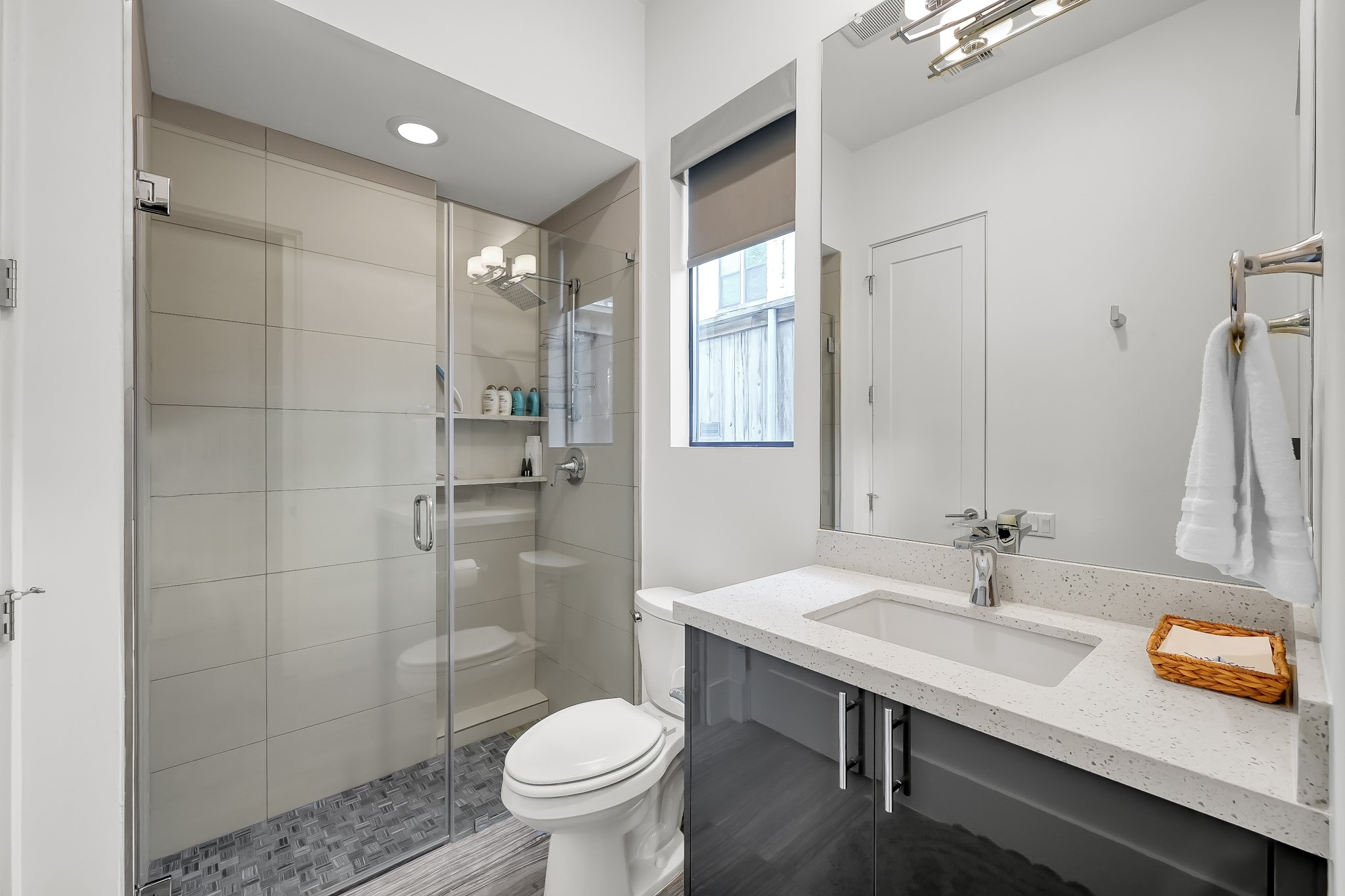 3207 Revere Street Houston, TX 77098 - Photo 14 of 50 a bathroom with a sink toilet and shower
