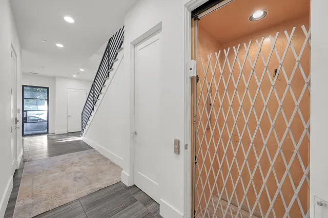 a view of entryway with wooden floor