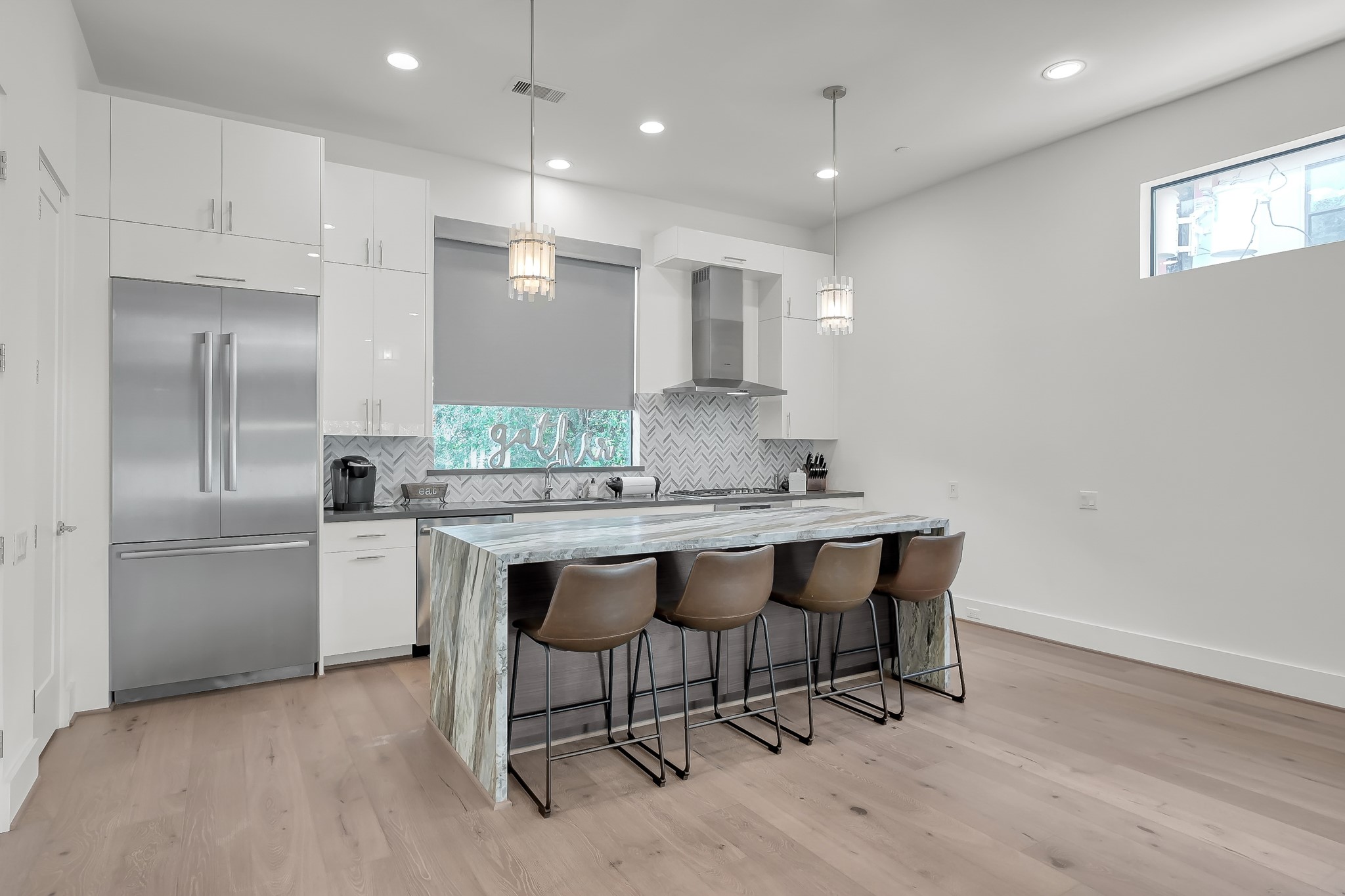 3207 Revere Street Houston, TX 77098 - Photo 17 of 50 a kitchen with stainless steel appliances granite countertop a sink a stove a refrigerator and a refrigerator