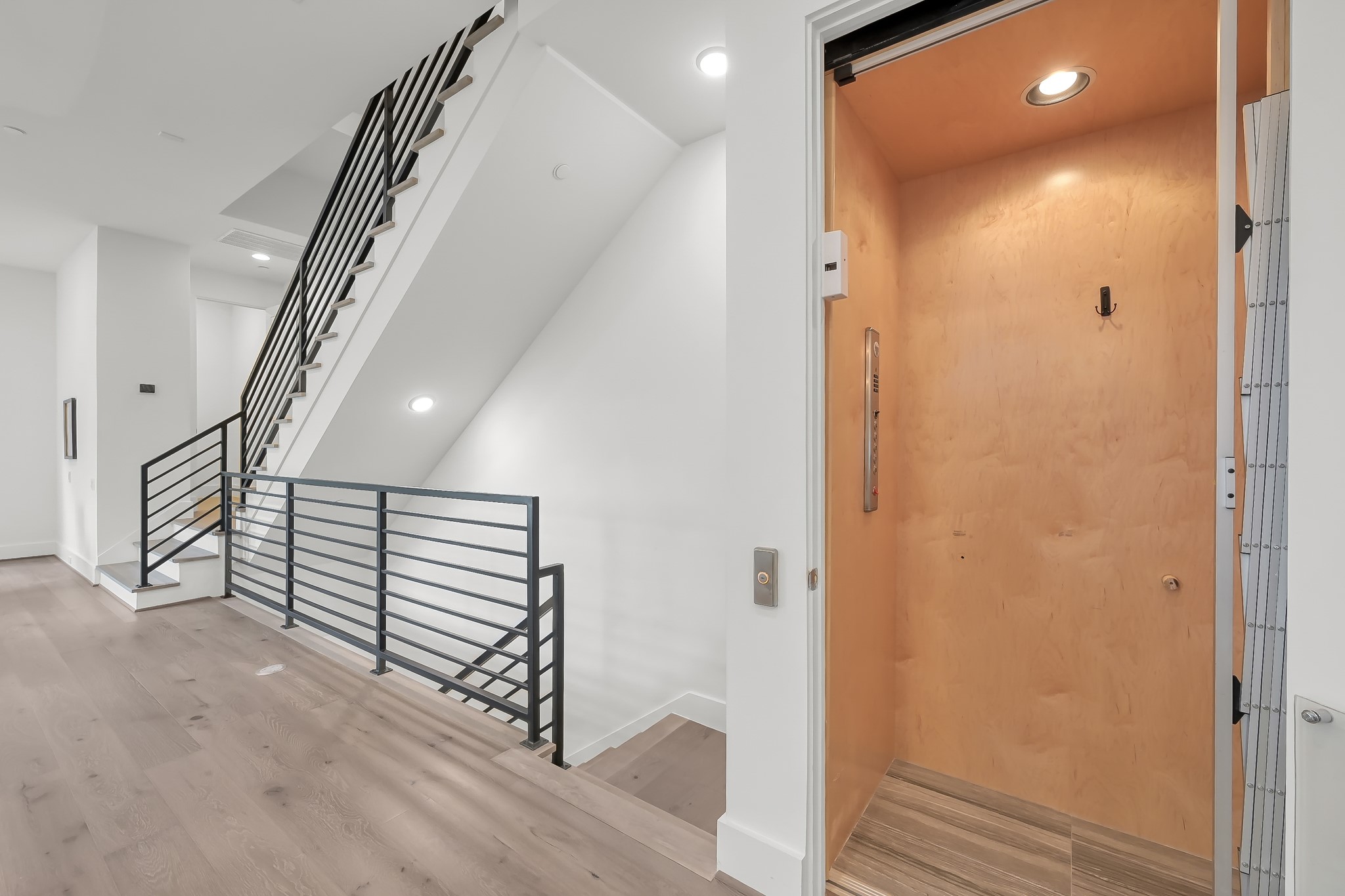 3207 Revere Street Houston, TX 77098 - Photo 22 of 50 a view of a hallway with stairs