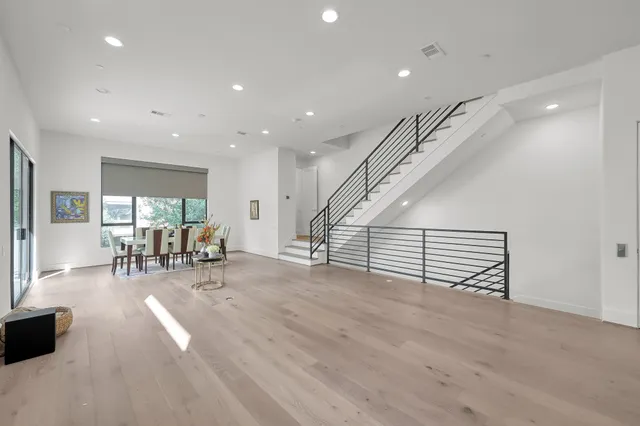 a view of a livingroom with furniture and white walls