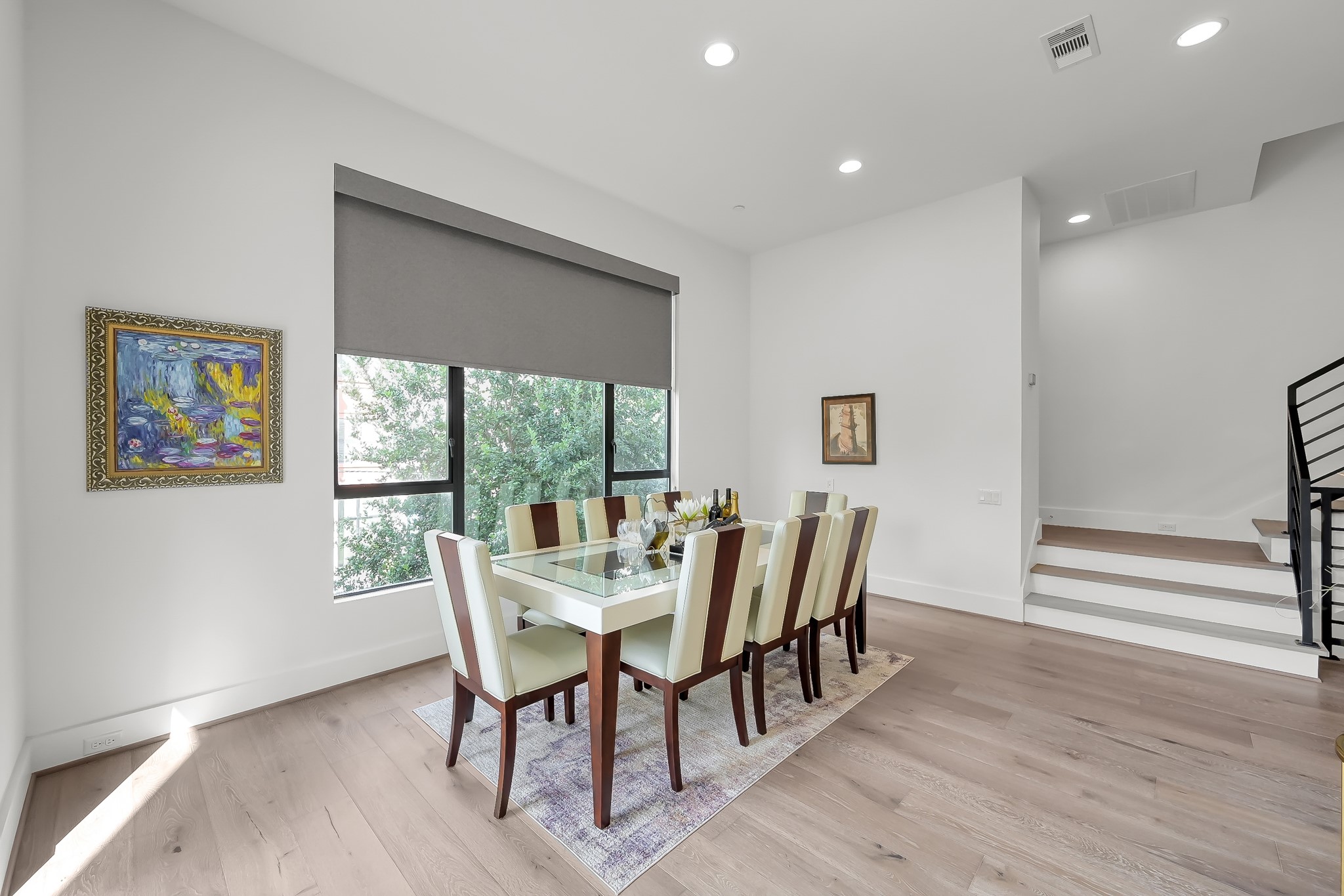 3207 Revere Street Houston, TX 77098 - Photo 27 of 50 a view of a dining room with furniture window and wooden floor