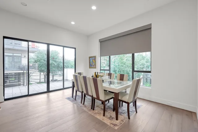 a dining room with furniture window wooden floor