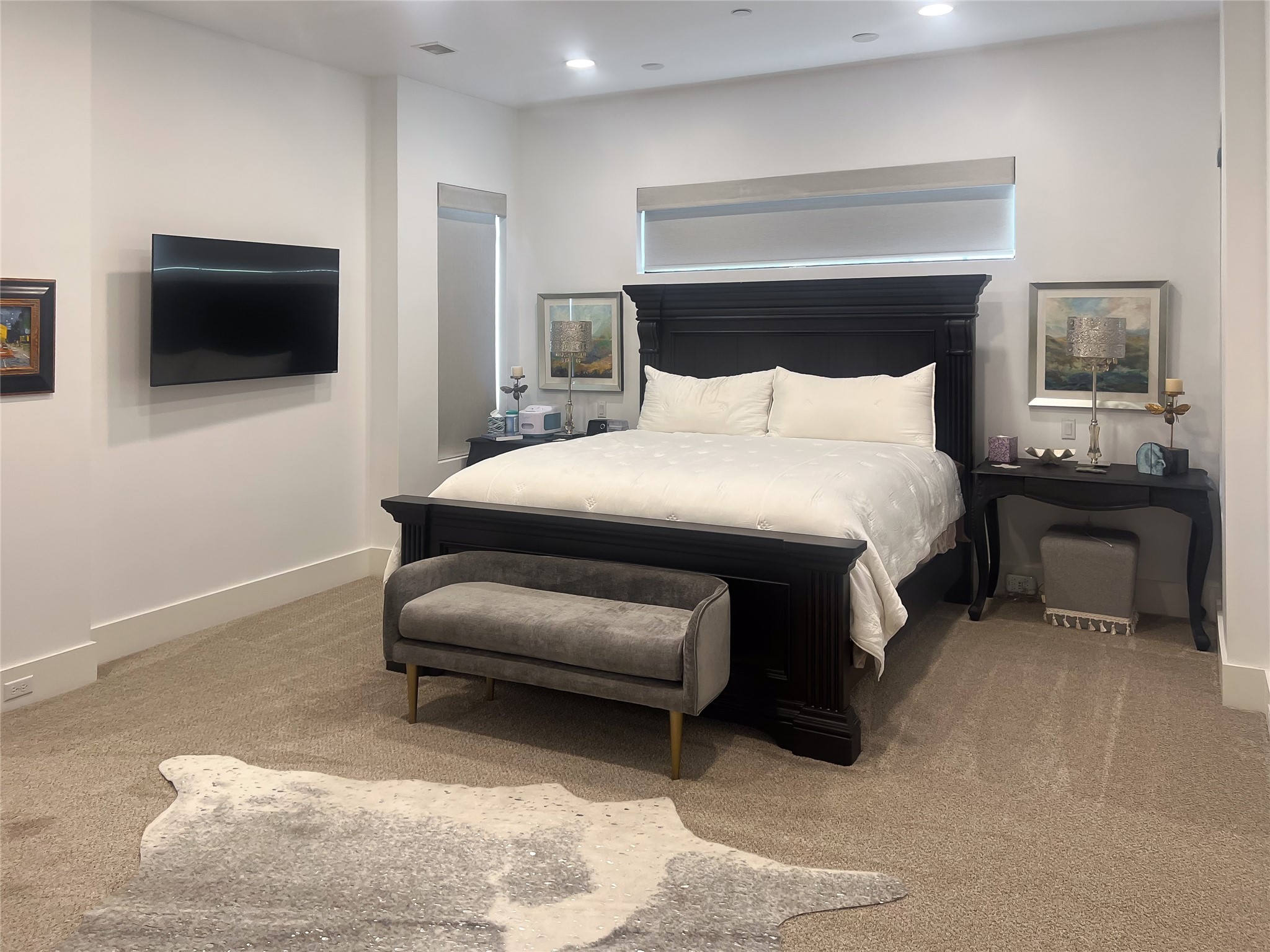 3207 Revere Street Houston, TX 77098 - Photo 34 of 50 a bedroom with a bed and a television