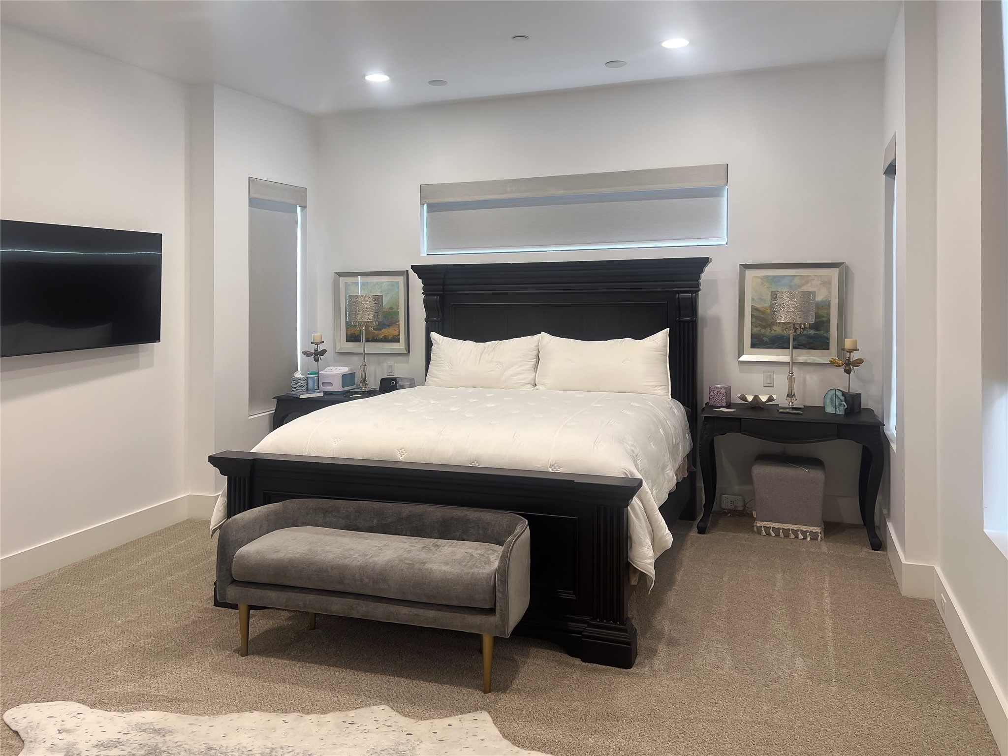 3207 Revere Street Houston, TX 77098 - Photo 36 of 50 a bedroom with a bed a television and a couch