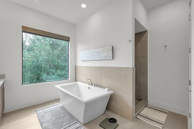 a bathroom with a sink and a window