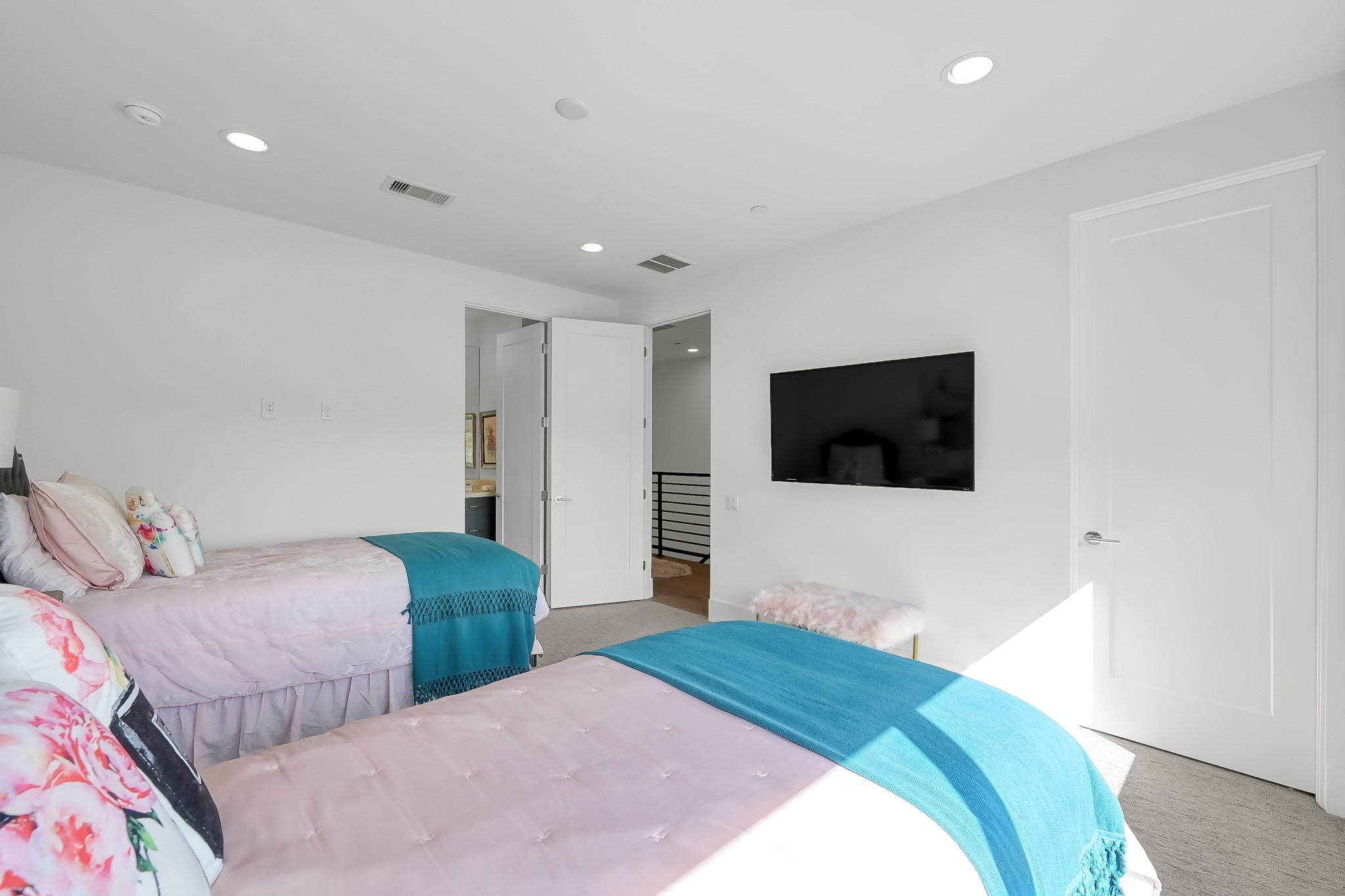 3207 Revere Street Houston, TX 77098 - Photo 44 of 50 a bedroom with two beds and a television