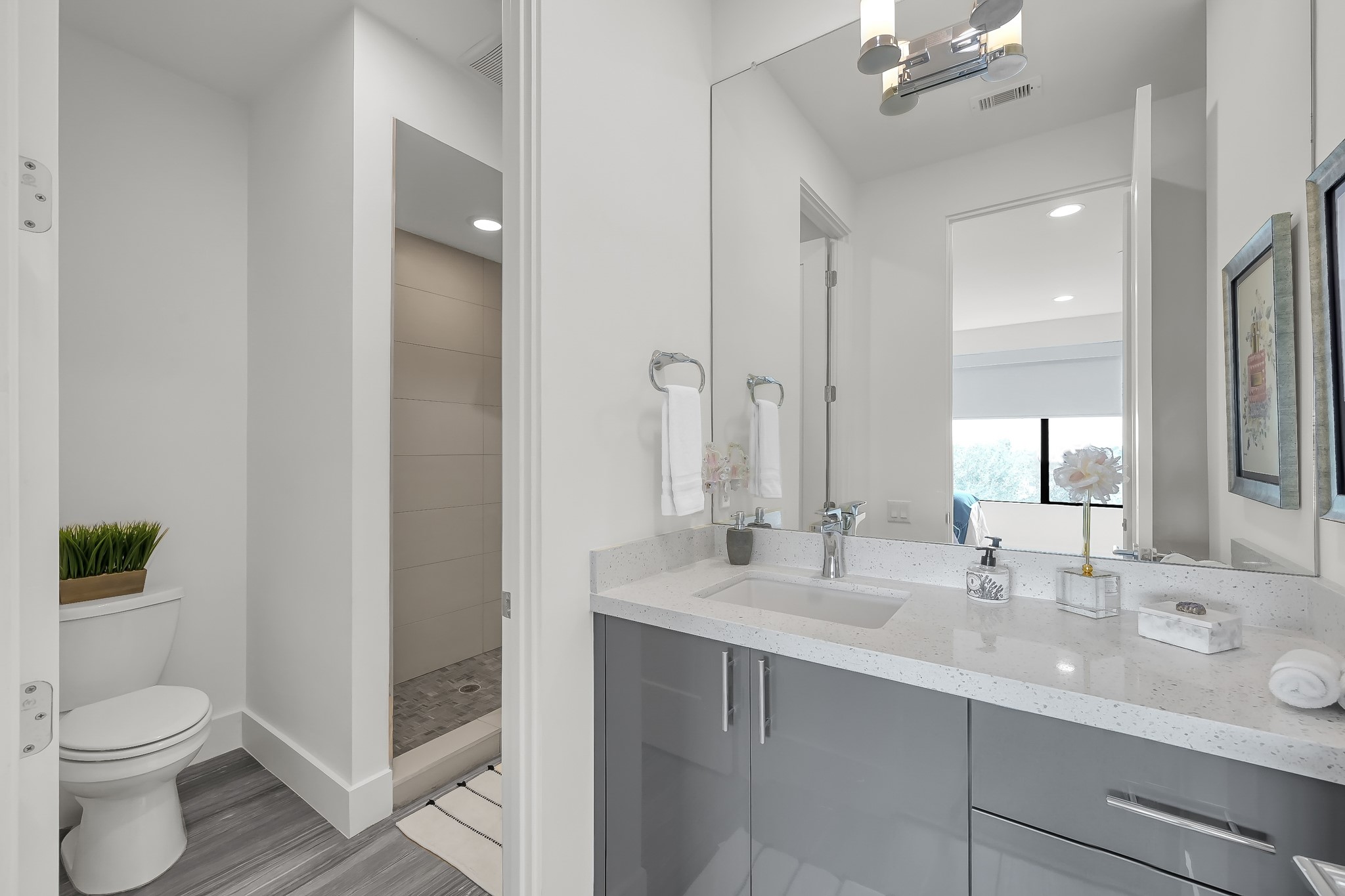 3207 Revere Street Houston, TX 77098 - Photo 45 of 50 a bathroom with a toilet sink and mirror