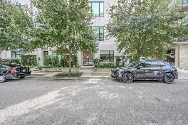 a view of a car parked in front of a building