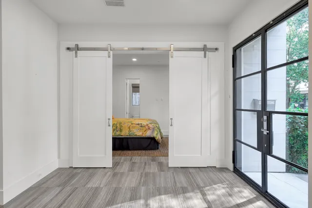 a view of room with hardwood floor and window