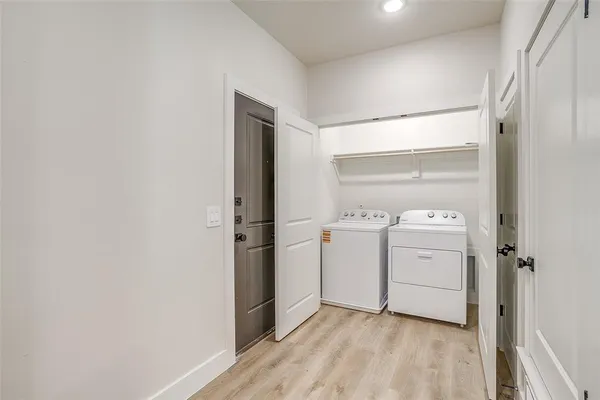 a spacious bedroom with a bed and a couch