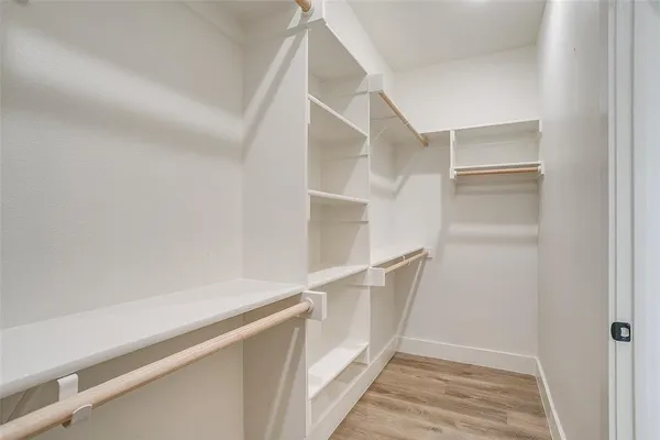 a view of a porch with a wooden fence