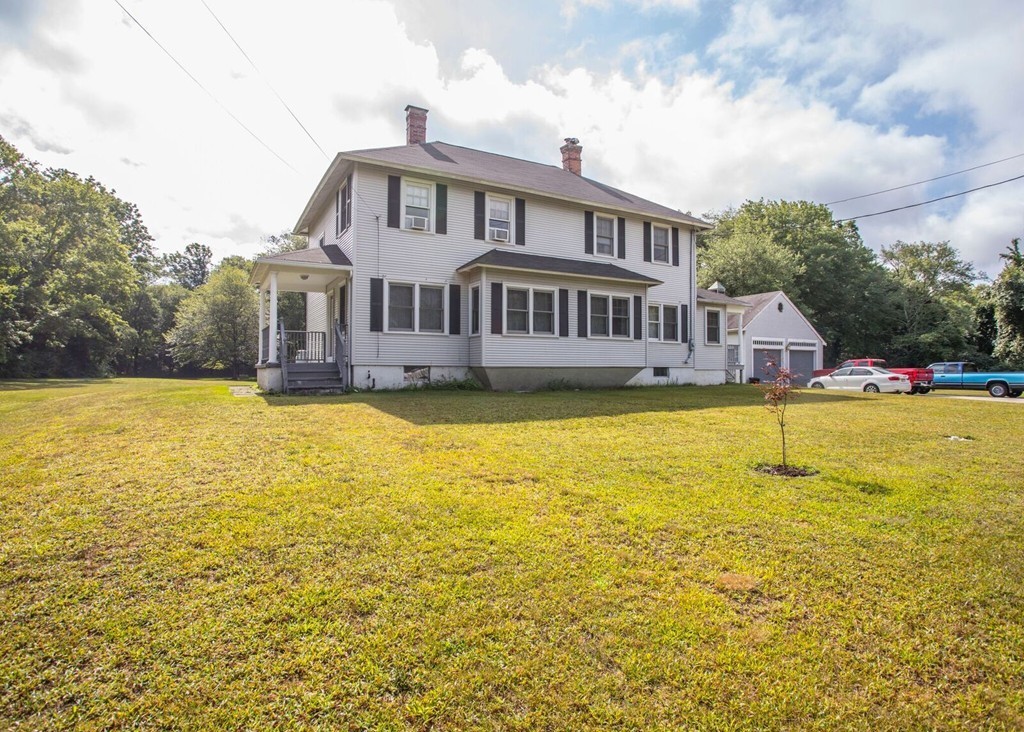 a swimming pool that is in front of the house