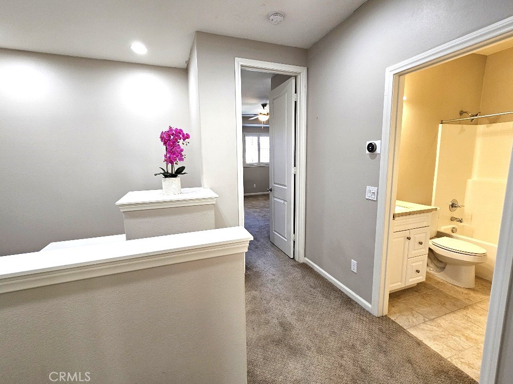 44011 Rivo Court Temecula, CA 92592 - Photo 16 of 34 a bathroom with a sink vanity and a mirror